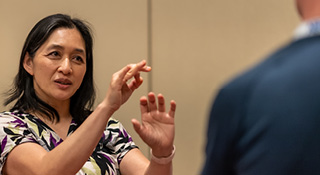 Dr. sharing ideas and talking with hands